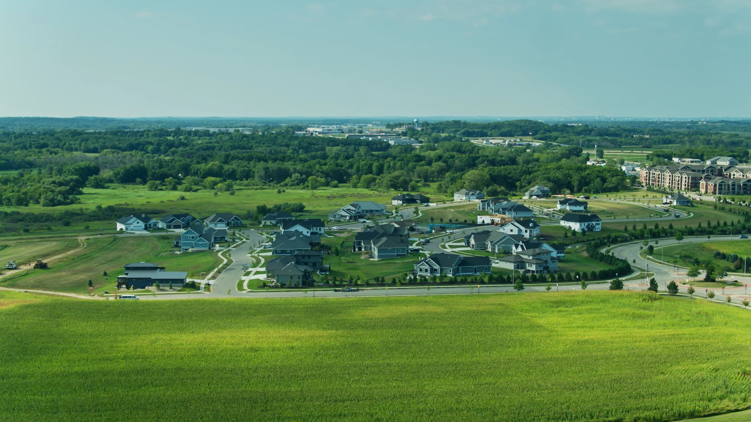 Landscaped neighborhood with homes and green space
